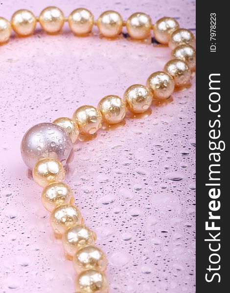 String of pearls on pink background. String of pearls on pink background.