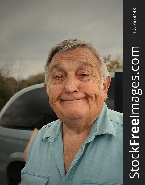 Senior man smiling with gray hair