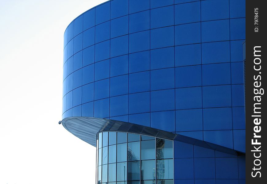 A large blue circular building. A large blue circular building