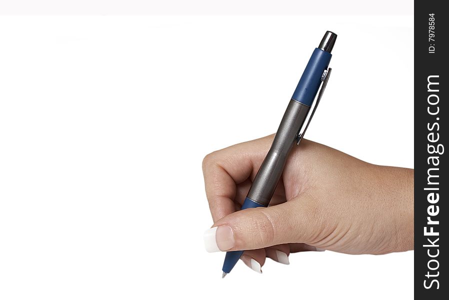 A macro picture of a female hand holding a pen. A macro picture of a female hand holding a pen