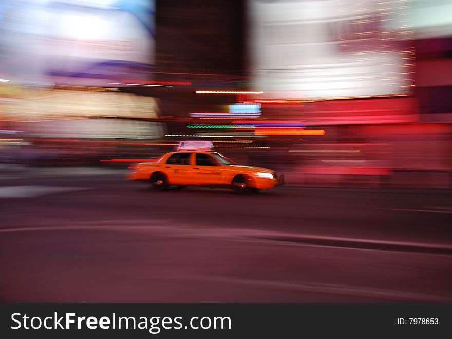A yellow cab, a New York City icon, speeding through the neon lights of Times Square at midnight. A yellow cab, a New York City icon, speeding through the neon lights of Times Square at midnight