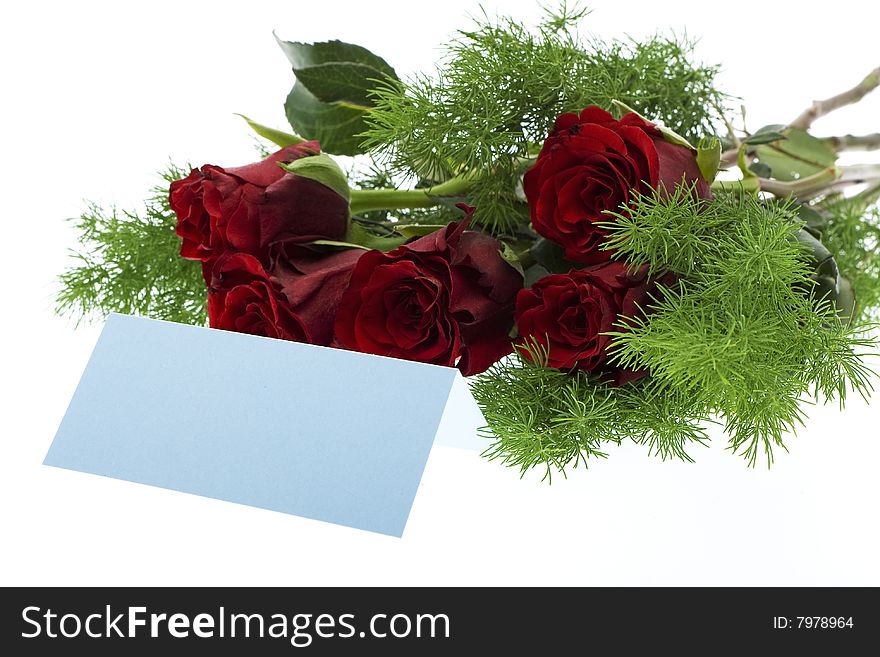 Red roses with a blue place card, symbol for the valentine day, mother day, wedding day or birthday