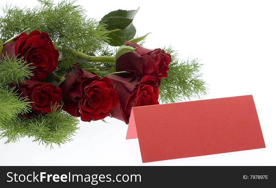 Red roses with a red place card, symbol for the valentine day, mother day, wedding day or birthday