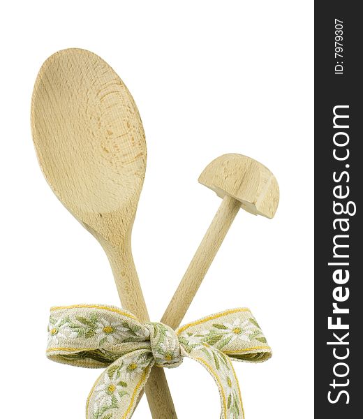 Country kitchen utensils - cooking tools - a wooden spoon and a twirling stick with a natural fabric ribbon, isolated on white.