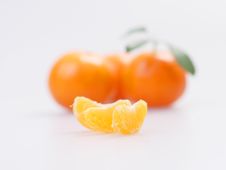 Three Clementines With Segments Royalty Free Stock Photos Three Clementines With Segments Royalty Free Stock Photos