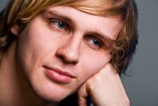 Young Man With A Serious Look Over Gray Royalty Free Stock Image