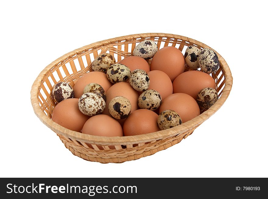 Differents  eggs in the basket isolated on a white background. Differents  eggs in the basket isolated on a white background.