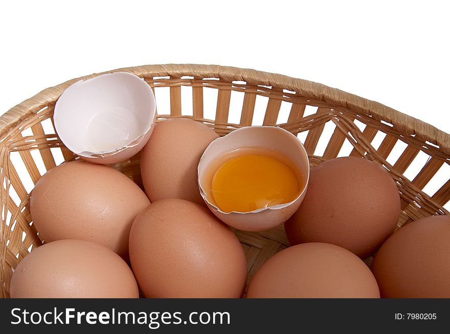 Eggs in the brown basket isolated on a white background. Eggs in the brown basket isolated on a white background.