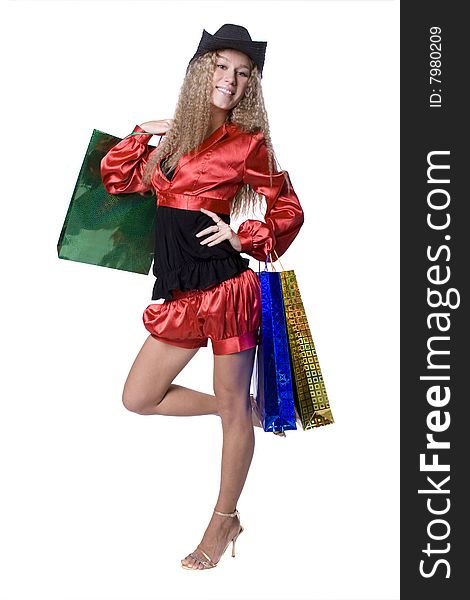 The young beautiful girl with purchases in colour packages during shopping on a white background