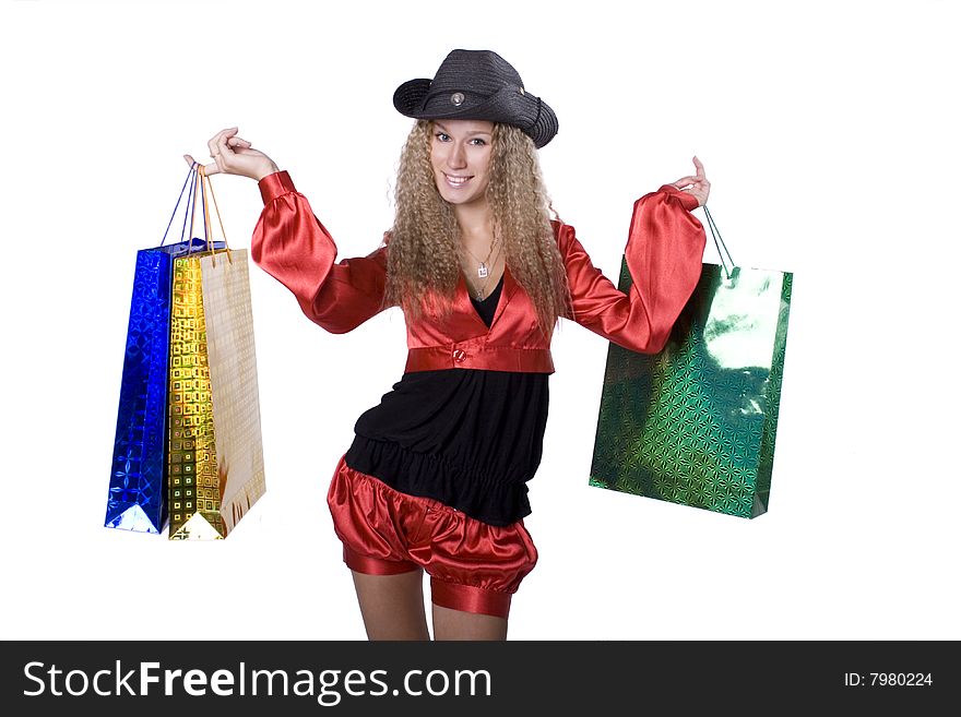 The young beautiful girl with purchases in colour packages during shopping on a white background