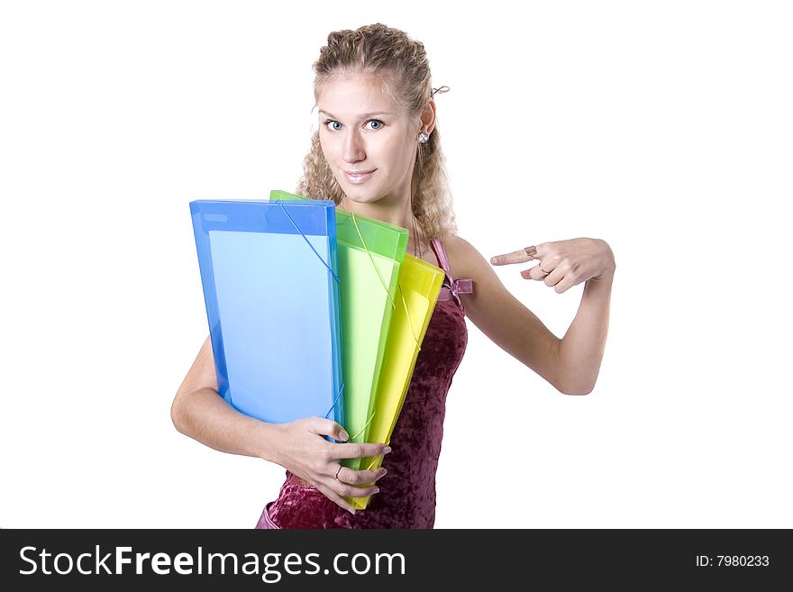 The young beautiful businesswoman at office behind work on a white background. The young beautiful businesswoman at office behind work on a white background