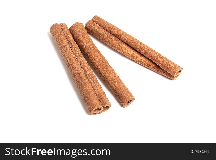 Three cinnamon sticks isolated on white background. Three cinnamon sticks isolated on white background.