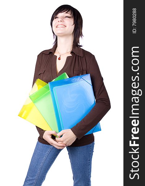 The young beautiful businesswoman at office behind work on a white background. The young beautiful businesswoman at office behind work on a white background