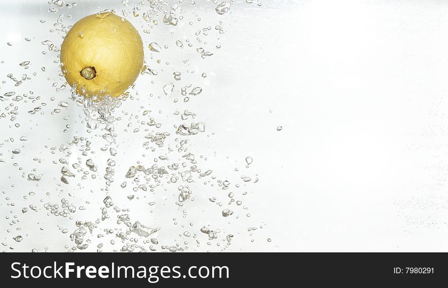 Citrus is dropped into fresh and clean water. Citrus is dropped into fresh and clean water.