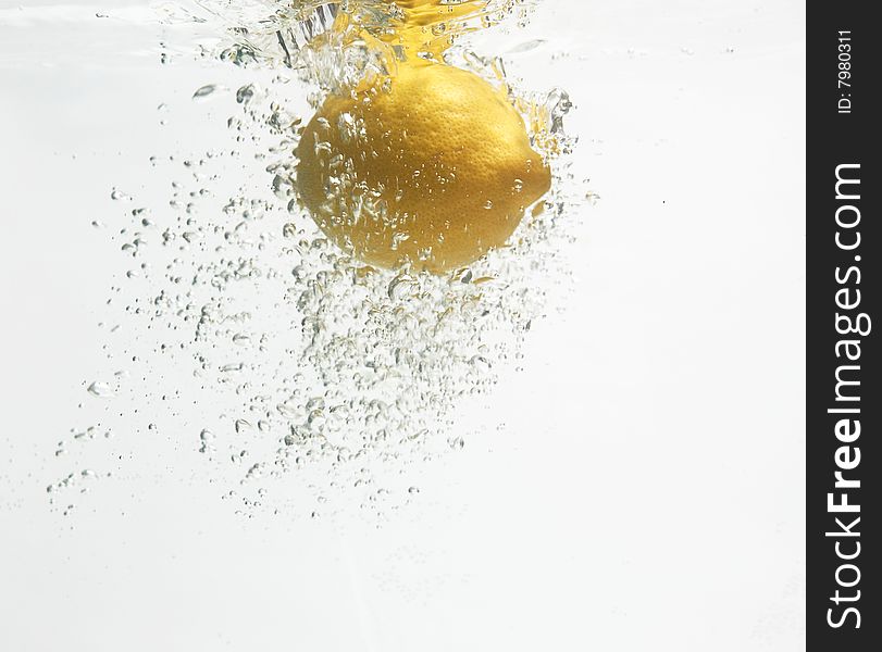 Lemon Is Dropped Into Clean Water 2.