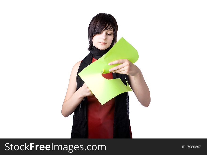 The young beautiful businesswoman at office behind work on a white background. The young beautiful businesswoman at office behind work on a white background