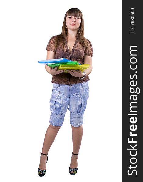 The young beautiful businesswoman at office behind work on a white background. The young beautiful businesswoman at office behind work on a white background