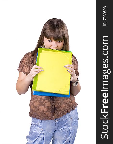 The young beautiful businesswoman at office behind work on a white background. The young beautiful businesswoman at office behind work on a white background