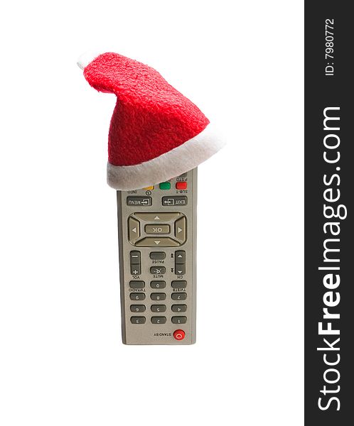 Remote control in a Christmas hat isolated