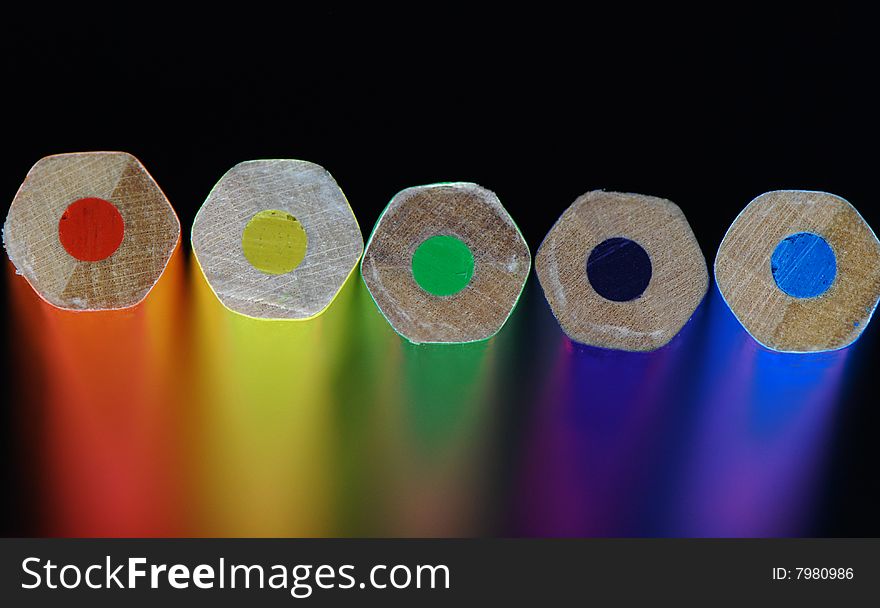 Five color pencils. The back background is washed away. Five color pencils. The back background is washed away