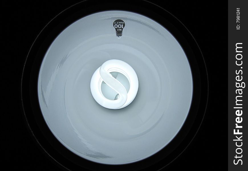 Close up of fluorescent energy saving bulb in lamp. Close up of fluorescent energy saving bulb in lamp.