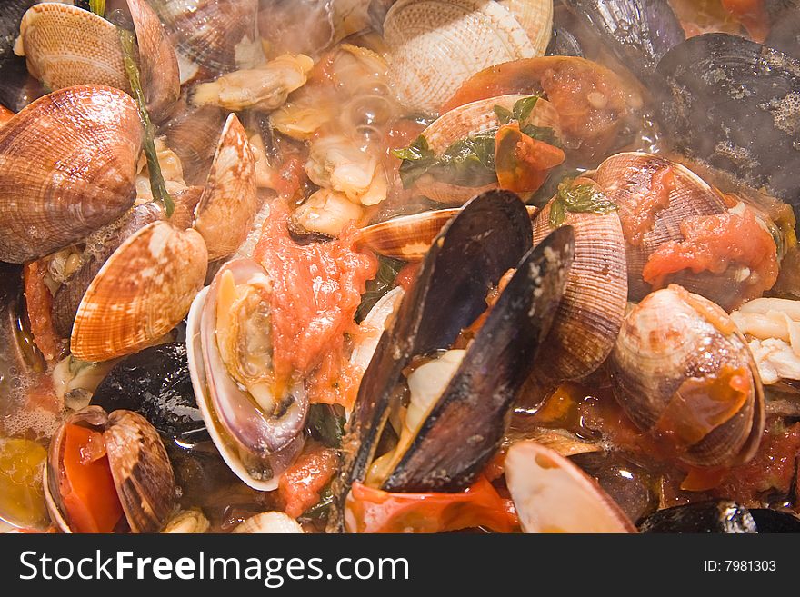 A beautiful cooked of mussels and clams