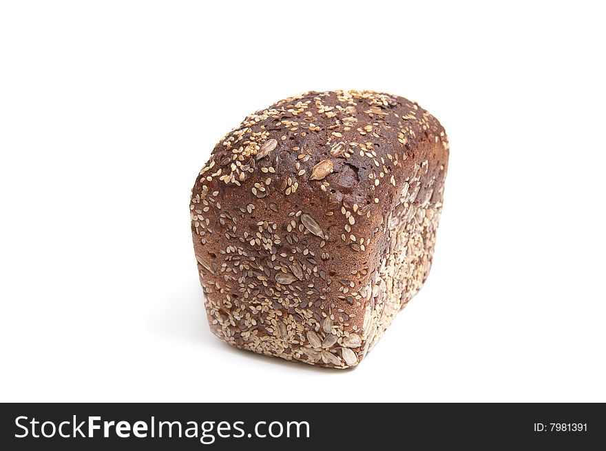 Loaf of bread full of seeds isolated on a white background. Loaf of bread full of seeds isolated on a white background.