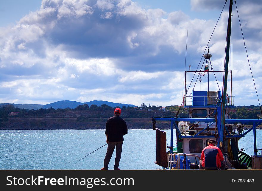 Two men fishing in the sea