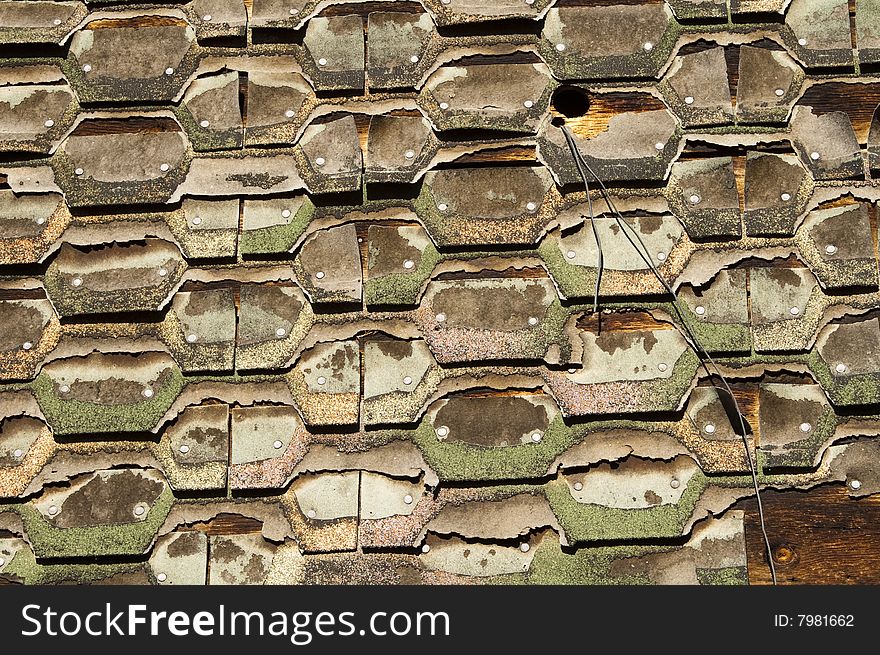 Abstract pattern of shingles used as siding on an exterior wall. Abstract pattern of shingles used as siding on an exterior wall