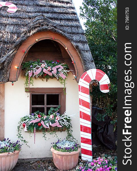 A window of a country cottage is decorated for Christmas. A window of a country cottage is decorated for Christmas