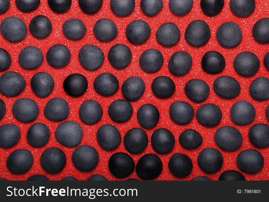 Background from black stones on red sand. Background from black stones on red sand