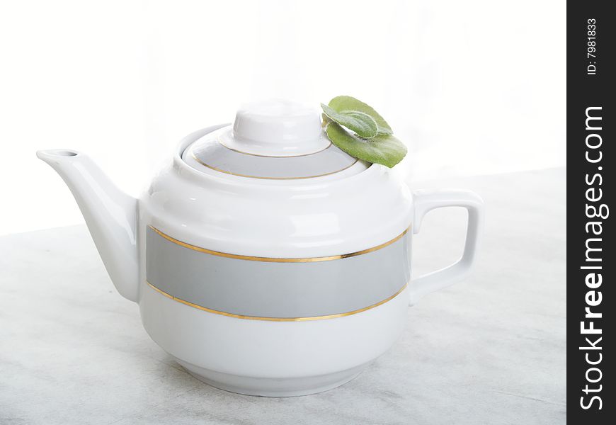 Brewing teapot for tea on a background