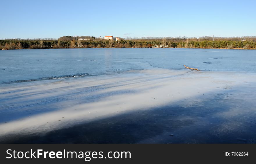 Frozen lake in winter with blue sky. Frozen lake in winter with blue sky