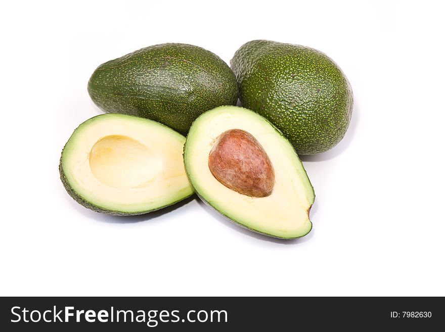 Whole avocado and two halves. Whole avocado and two halves