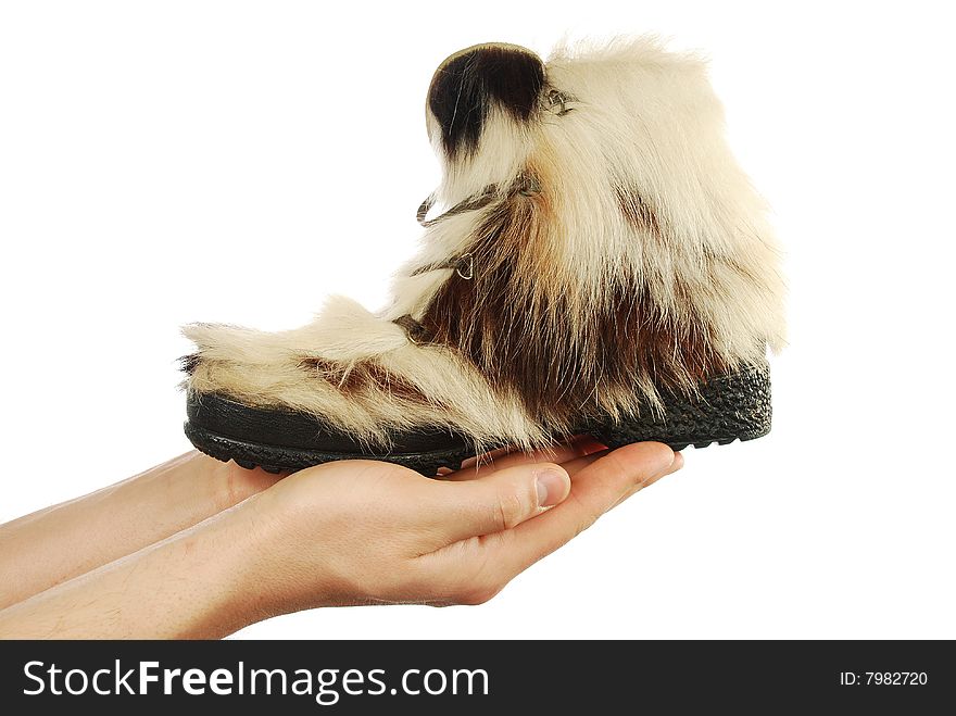 Winter boots on hands on a white background