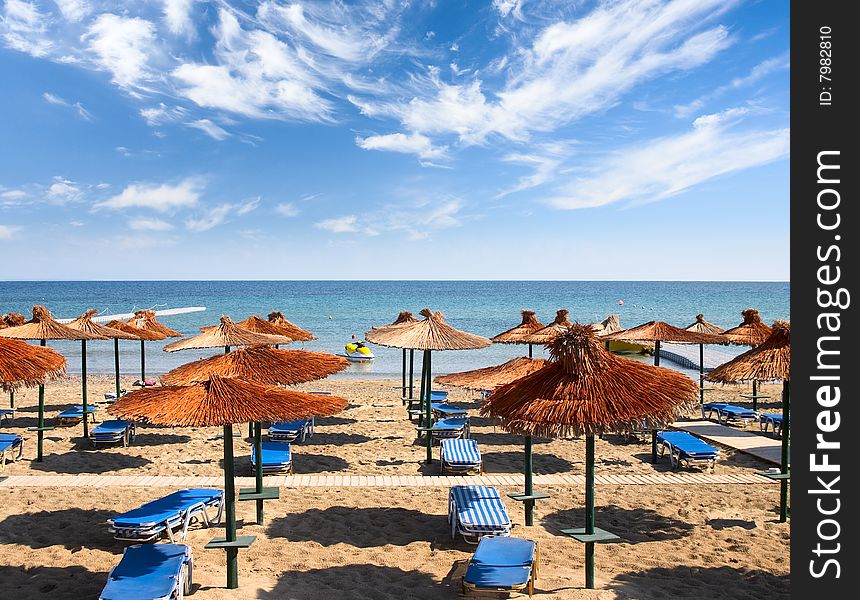 Beach with sunshades and  beds