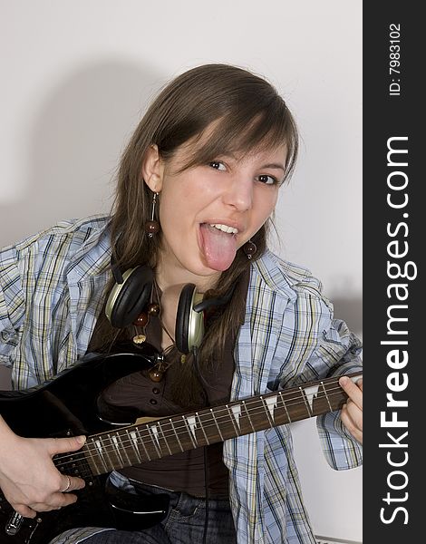 Young woman playing in guitar. Young woman playing in guitar