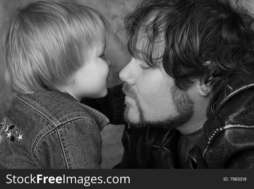 Son kissing Daddy Biker Jackets on, Black and White. Son kissing Daddy Biker Jackets on, Black and White