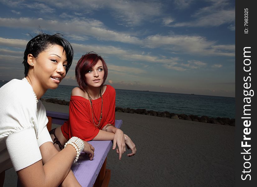 Two beautiful young women on the beach. Two beautiful young women on the beach