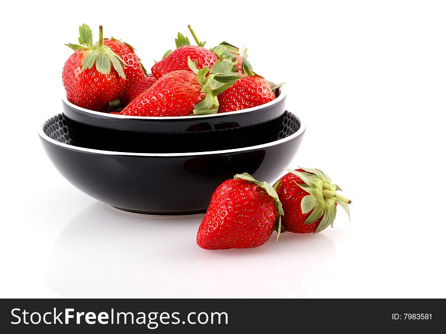 Bowl full of strawberries isolated on white. Bowl full of strawberries isolated on white.