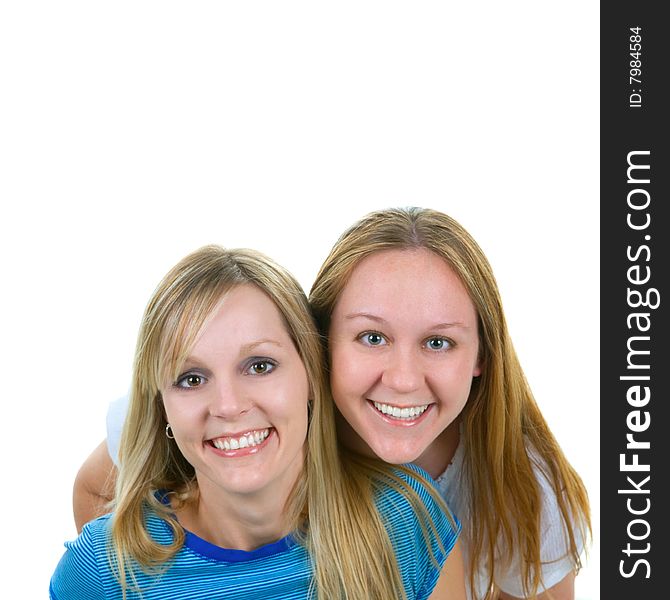 Two sisters smiling with copy space above