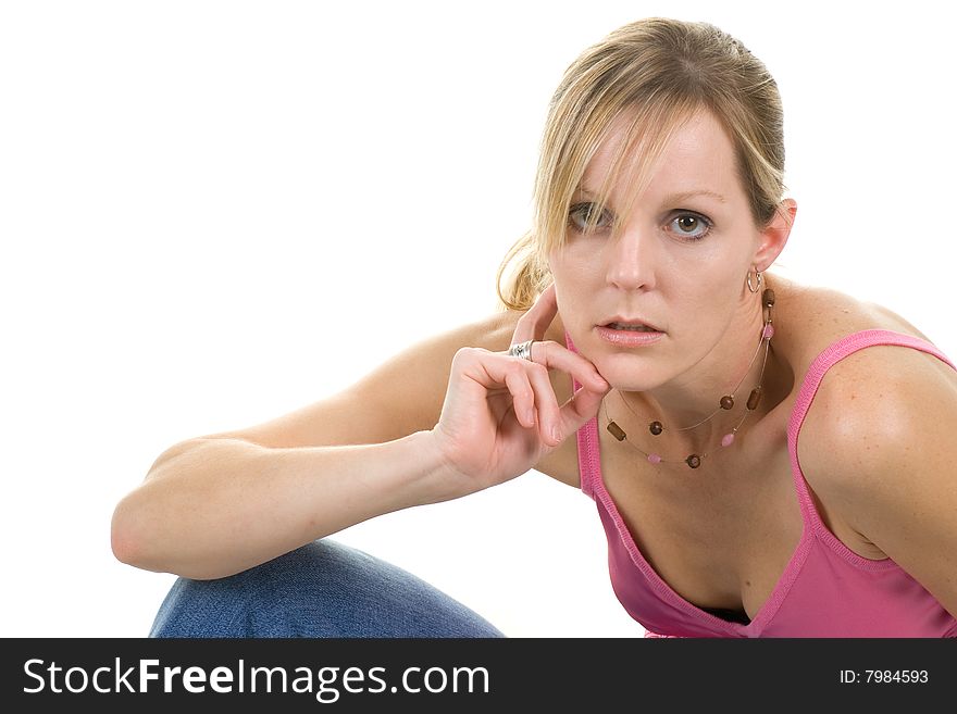 Casually posed blond woman wearing a pink tanktop. Casually posed blond woman wearing a pink tanktop