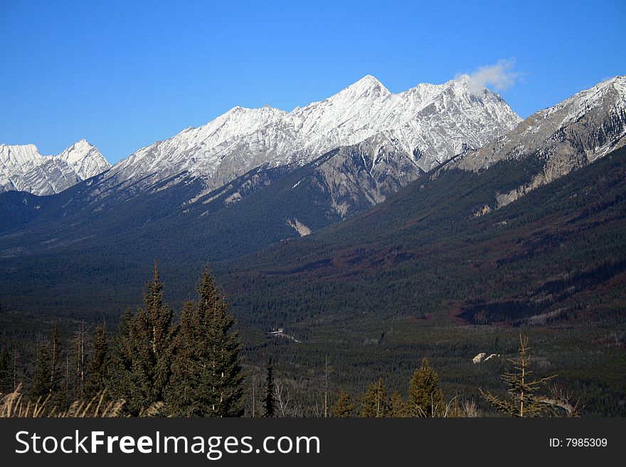 View of Canadian Rocky Mountains with snow on peaks. View of Canadian Rocky Mountains with snow on peaks