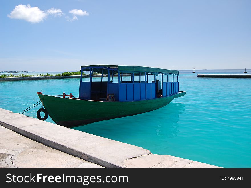 Boat at the letty in the azure lagoon. Boat at the letty in the azure lagoon