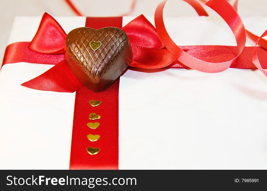 I love you - red ribbons and heart chocolates isolated over white