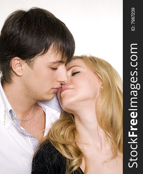 Kissing couple isolated over white