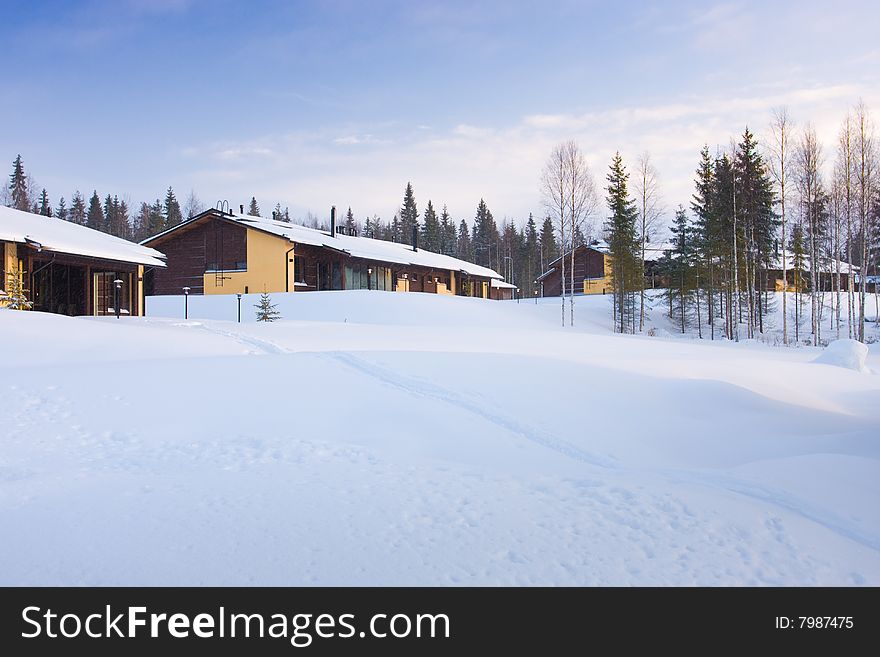 Winter landscape with cottages covered by snow. Winter landscape with cottages covered by snow