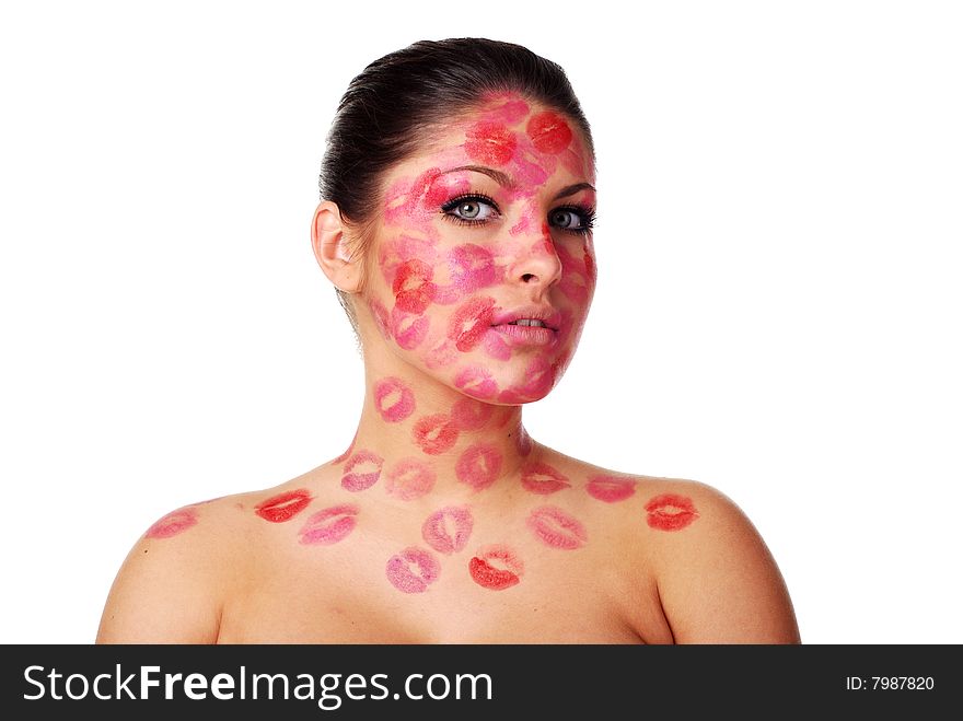 Beautiful woman with stamps of red  lipstick on her face
