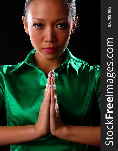 Portrait of a beautiful young woman in green shirt