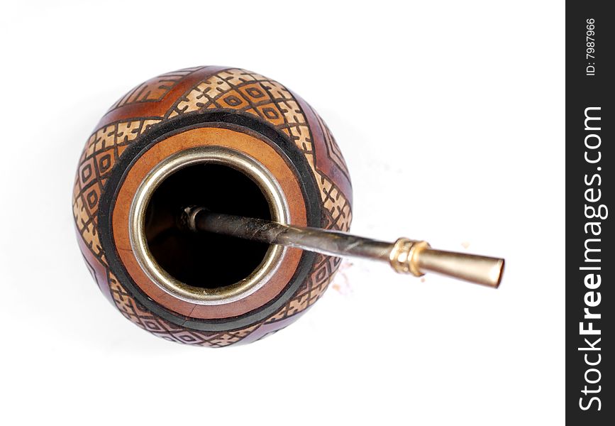 Calabash with ethnic ornament and metal straw. Calabash with ethnic ornament and metal straw